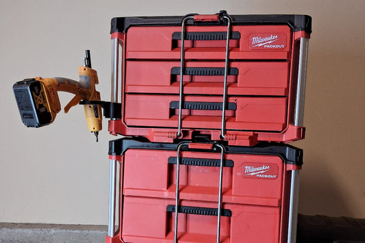 A Milwaukee Packout tool box with a glue gun holder attachment