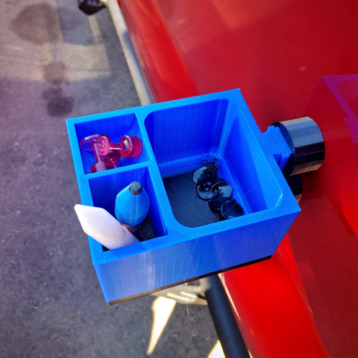 An organizer for glue pulling in paintless dent repair with magnet attached to a truck door panel