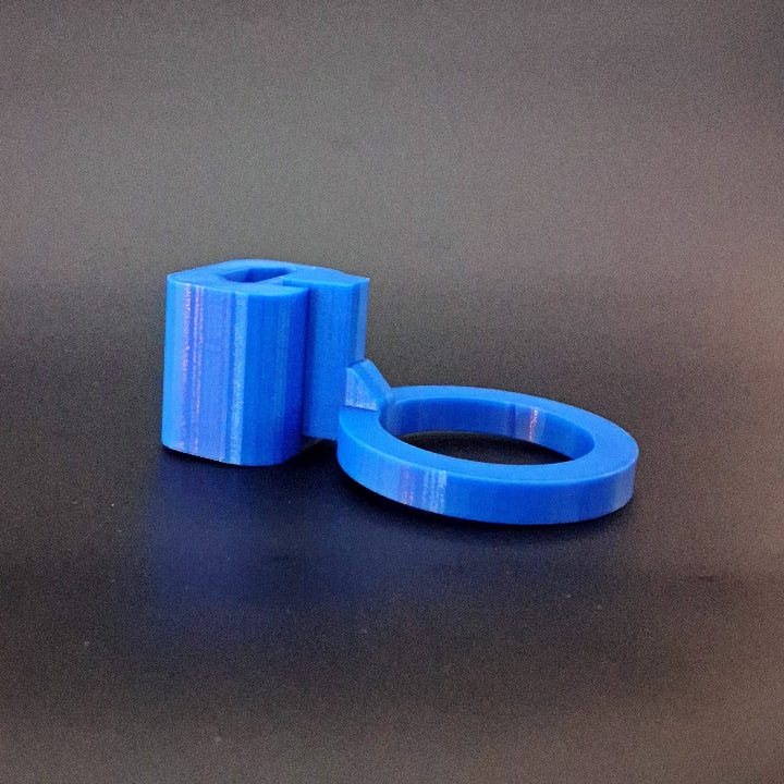 A blue mounting arm attaching a glue gun to Milwaukee Packout tool boxes
