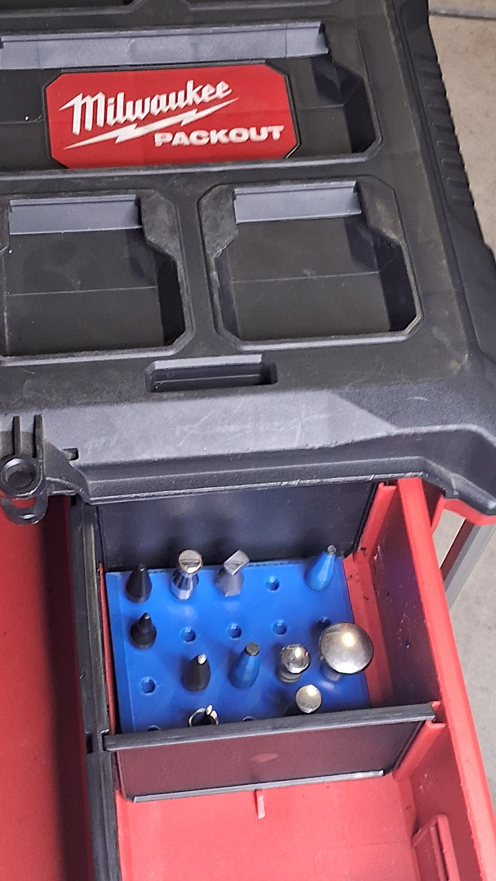 A Milwaukee Packout toolbox drawer open with a threaded tip holder inside